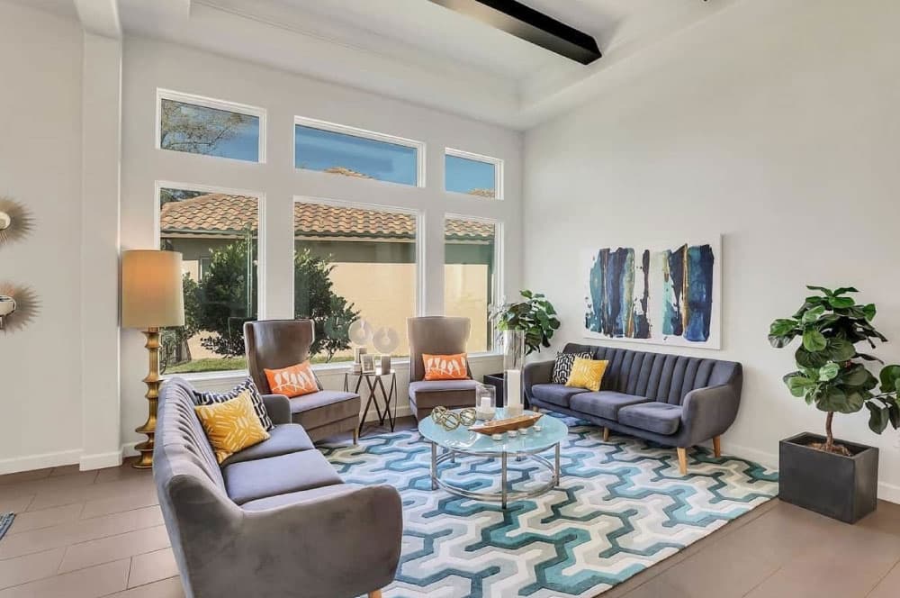 Bright modern living room with large windows.
