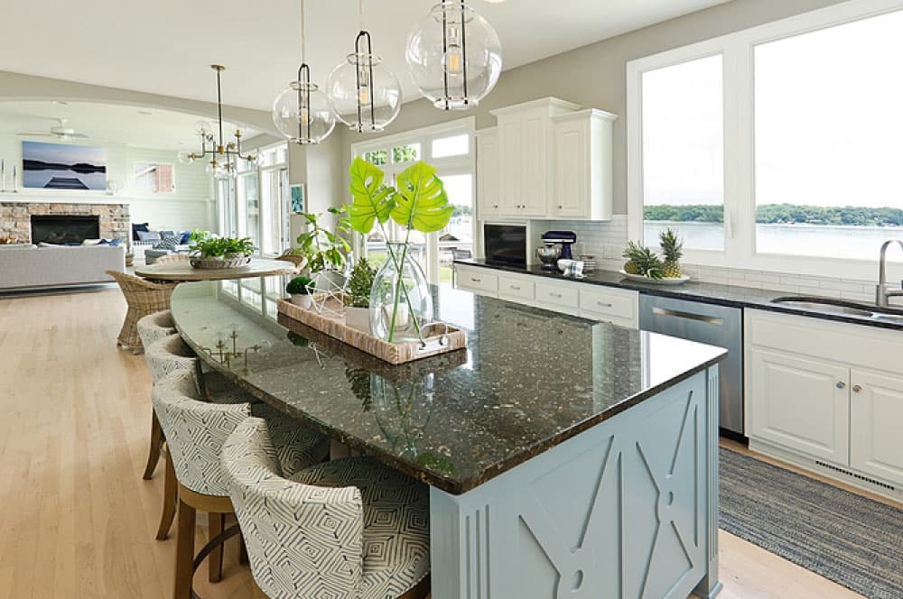 Spacious open-concept kitchen and living area with large window.