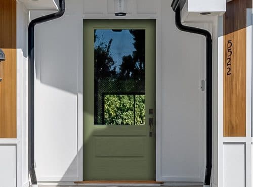 a green glass door and a white wall